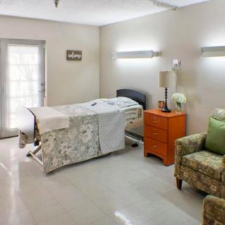 A cozy and well-lit patient room in a medical facility.