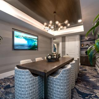 A modern dining room with stylish decor and elegant lighting.