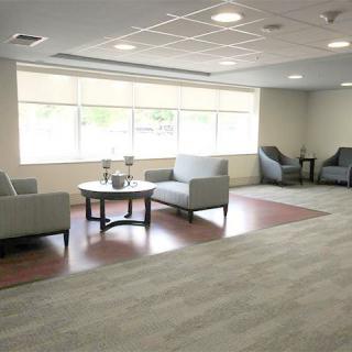 A modern waiting area with comfortable seating and ample natural light.