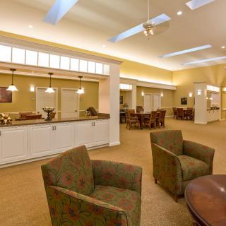 A spacious and modern interior with ample seating and ceiling lights.