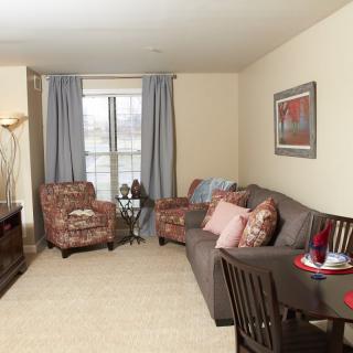 A cozy living room with comfortable seating and warm decor.