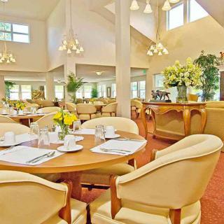Elegant dining area with beautifully arranged tables and floral decor.