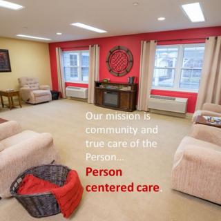 A cozy living room emphasizing community and person-centered care.