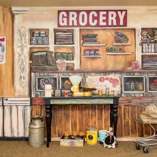 A vintage-style grocery store display with old-fashioned items and decor.