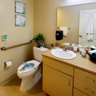 A clean and organized bathroom with essential amenities.