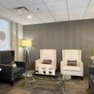 A modern waiting room with comfortable seating and stylish decor.