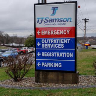 Sign directing to various services at TJ Samson Community Hospital.