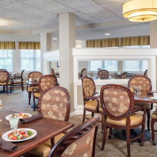 A well-furnished dining area with elegant seating and decor.