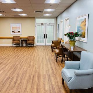 A modern waiting area with comfortable seating and decorative artwork.