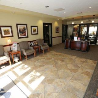 A spacious and welcoming reception area with seating and a front desk.