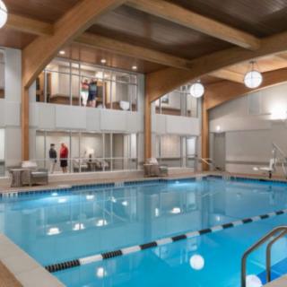 A luxurious indoor swimming pool with modern architectural design.