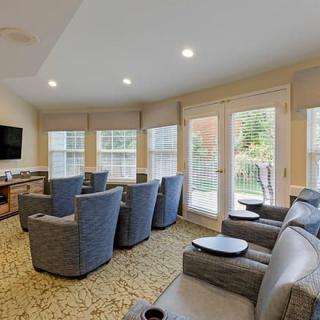 A modern living room with comfortable seating and ample natural light.