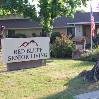 Entrance sign and building of Red Bluff Senior Living facility.