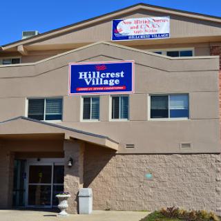 The exterior view of Hillcrest Village, a residential facility.