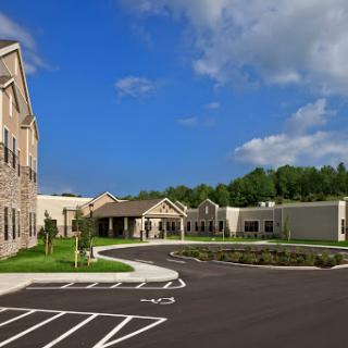 A modern residential facility with a well-designed exterior and a clear blue sky.