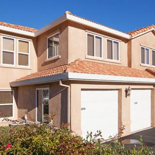 A two-story suburban house with a double garage.