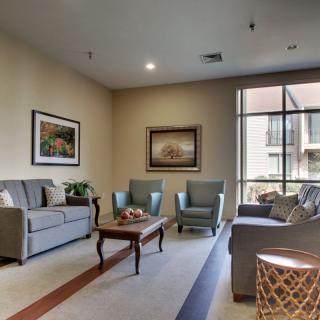 A cozy living room with comfortable seating and warm lighting.