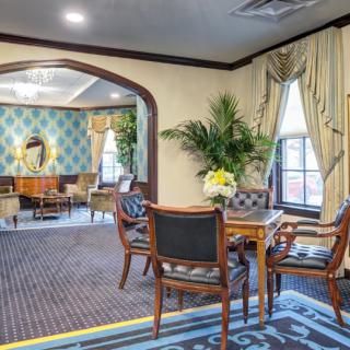 Elegant hotel lobby with seating area and classic decor.