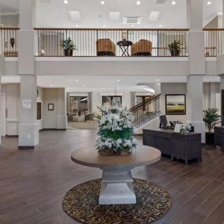 Spacious lobby with elegant decor and seating area.