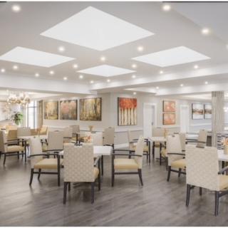 A modern and elegantly designed dining area with ample seating and sophisticated lighting.