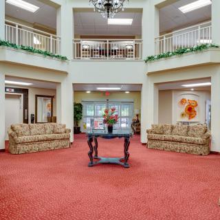 A spacious lobby with comfortable sofas and decorative elements.
