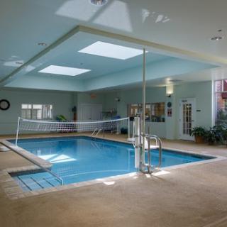 A serene indoor swimming pool area, perfect for relaxation and wellness activities.