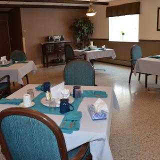 A well-organized dining area featuring neatly set tables and a calm atmosphere.