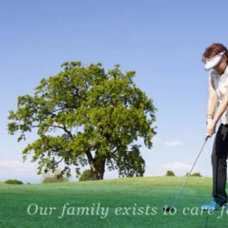 A woman playing golf near a large tree with the text 'Our family exists to care.'