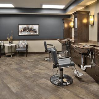 A modern barber shop interior with sleek chairs and stylish decor.