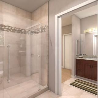 A modern bathroom with a glass-enclosed shower and contemporary vanity.