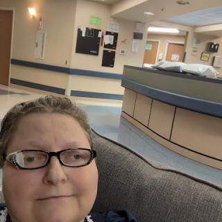 A patient resting in a hospital setting, capturing a moment of calm amidst the healthcare environment.