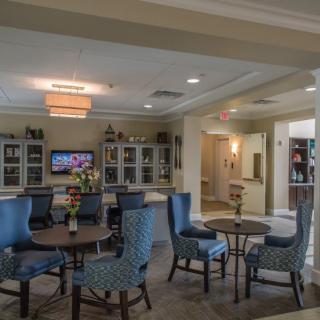 A cozy lounge area with comfortable seating and a television.