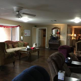 A cozy living room with comfortable seating and elegant decor.