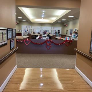 A view of the reception area in a healthcare facility, featuring festive decorations.
