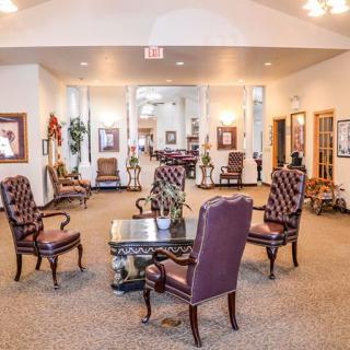 A spacious lobby with elegant seating arrangements and classic decor.
