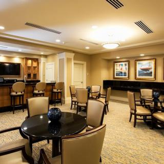 A comfortable lounge area with multiple seating arrangements and elegant decor.