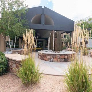 A modern house with contemporary landscaping and architectural design.