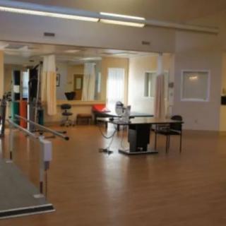 Rehabilitation room equipped for physical therapy exercises.