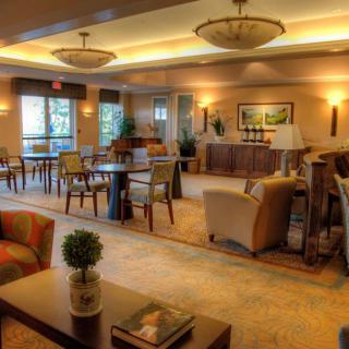 A comfortable lounge area with modern decor and ample seating.