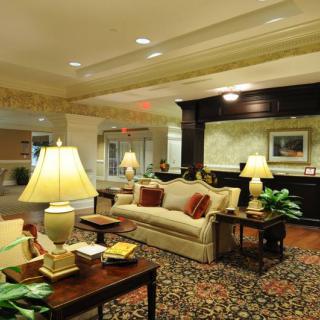 A cozy hotel lobby with comfortable seating and warm lighting.
