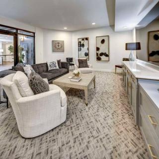 A modern living room with elegant furnishings and contemporary artwork.