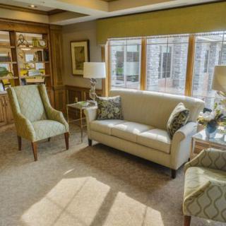 A cozy living room with elegant furniture and ample natural light.