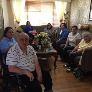 A group of people sitting together in a cozy living room setting.