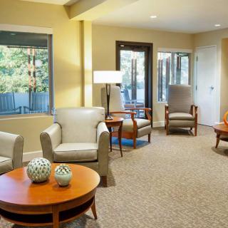 A cozy living room with comfortable seating and large windows.