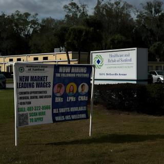 Outdoor signs advertising real estate and business services.