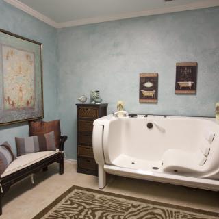 A cozy bathroom with a modern bathtub and elegant decor.
