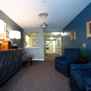 A cozy hallway with comfortable seating and warm lighting.