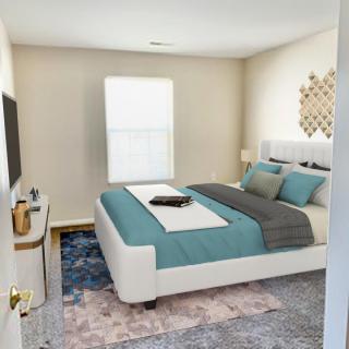 A modern bedroom with a stylish bed and chic decor.