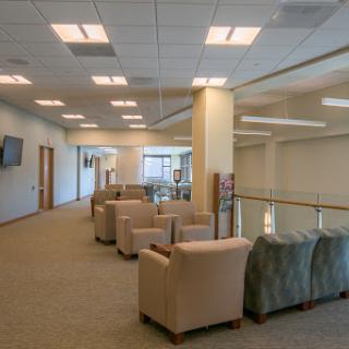 A spacious and inviting lounge area filled with comfortable seating, perfect for relaxation or informal meetings.