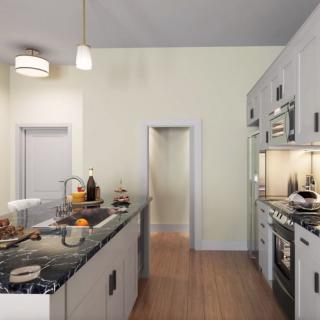 A modern kitchen with a central island, equipped with contemporary appliances and stylish lighting.